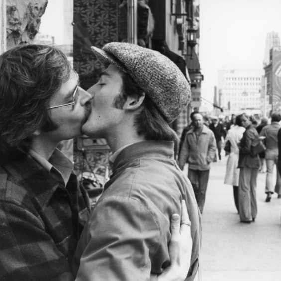 Two men kissing in public, 1986